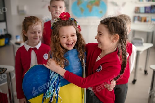 Preview: Schoolchildren welcoming new Ukrainian classmate, concept of enrolling Ukrainian kids to schools