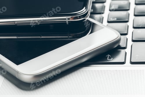 Preview: Laptop and mobile phone on the table. Workspace concept