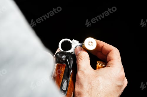 Preview: Male hands holding hunting rifle on black background