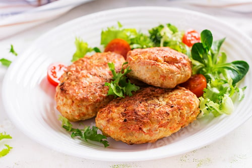 Preview: Meatballs with cabbage. Lazy cabbage rolls with fresh salad on light background. Russian cuisine.