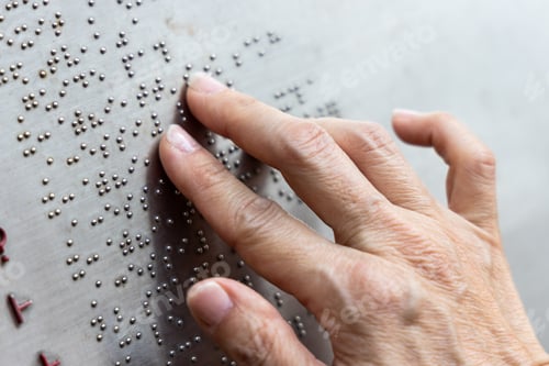 Preview: Finger reading braille tactile on public park message board
