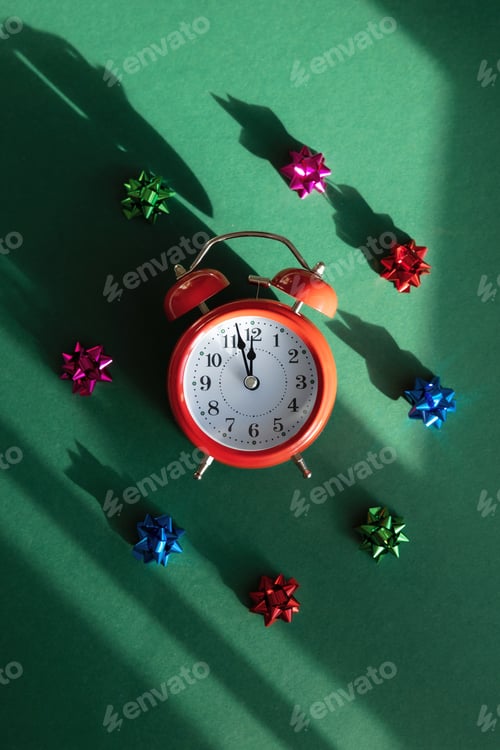 Preview: Red alarm clock and colorful bows with overlay shadow on green background.