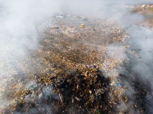 Preview: Aerial view of landfill with burning trash piles