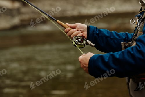 Preview: Man fishing in river, close-up