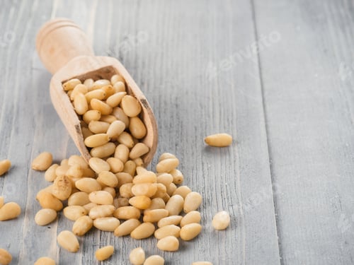 Preview: Pine nuts on gray wooden background