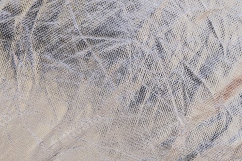 Preview: Macro of the texture of a metallic wrinkled plastic fabric, background for industrial