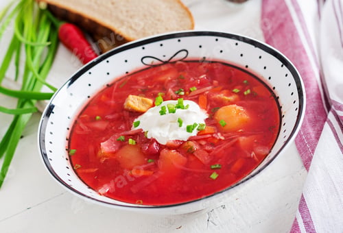 Preview: Traditional Ukrainian Russian borscht with white beans on the bowl. Beetroot soup.