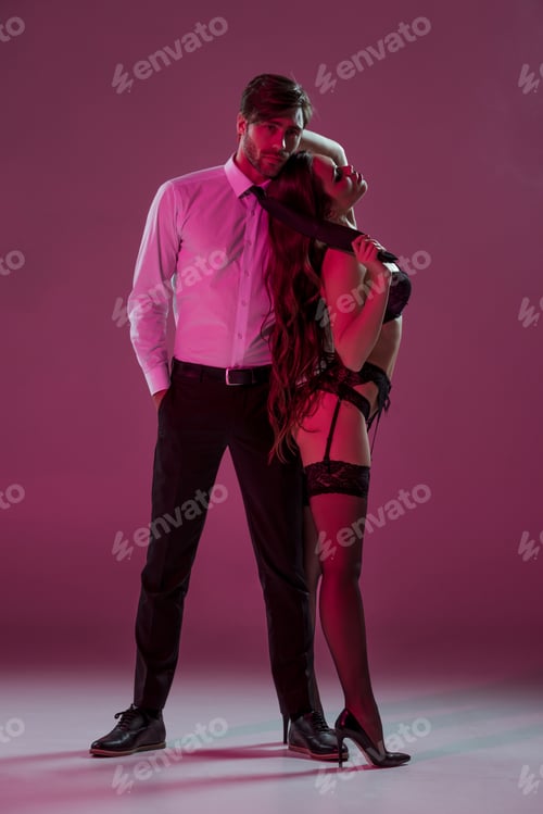 Preview: sexy girl in lingerie and stockings seducing elegant man
