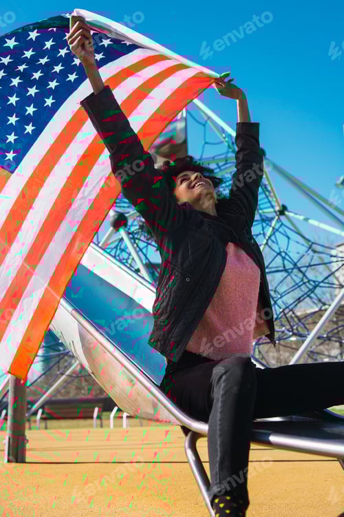 Preview: black woman with afro hair and an american flag.