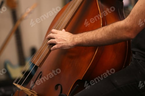 Preview: Closeup shot of a person playing the cello