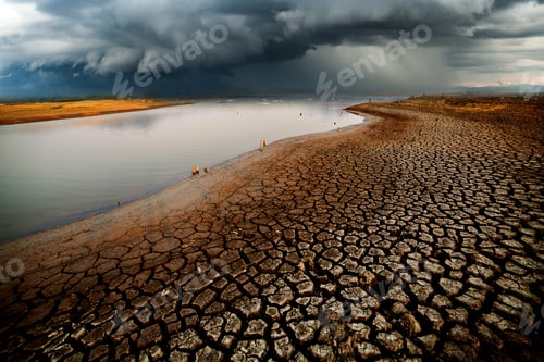 Preview: Parched Earth Next to Water Under Stormy Skies