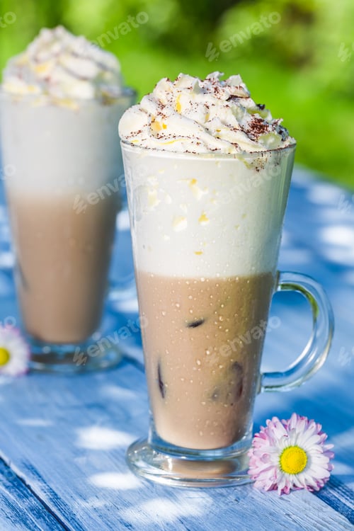 Preview: Cold latte with ice on old wooden table