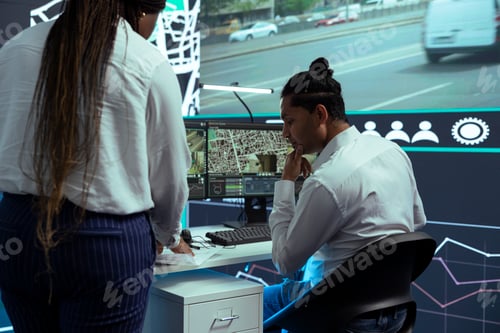 Preview: Indian employee consulting his african american team leader on cargo logistics