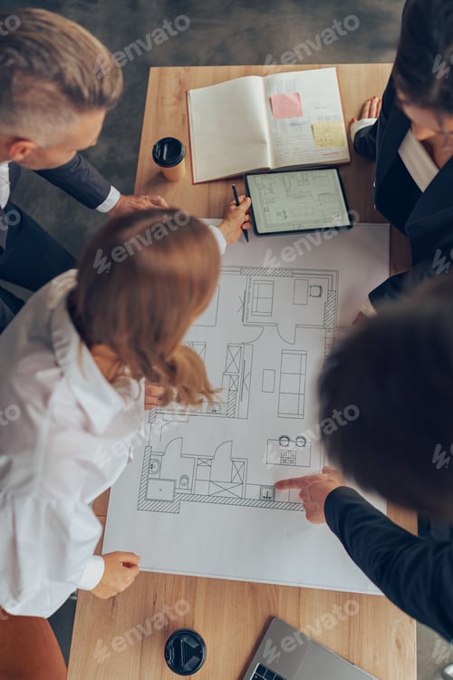 Preview: Group of professional business managers working with project documents in office