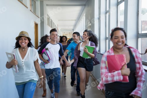 Preview: Students laughing and walking in a school hallway