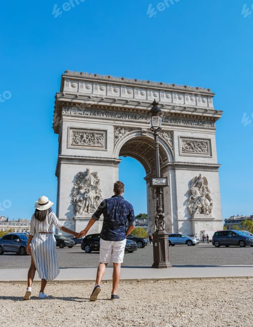 Preview: Couple on a citytrip in Paris visiting Avenue des Champs-Elysees Paris France Arc De Triomphe