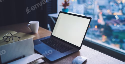 Preview: Laptop and notebook on wooden table