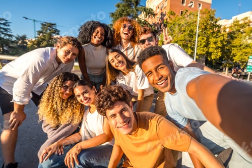 Preview: Multi-ethnic students taking selfie in the city