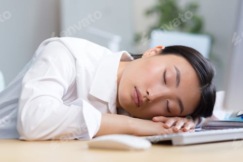Preview: Woman office worker tired Asian sleeps on the desk, overtired sleeps in the day