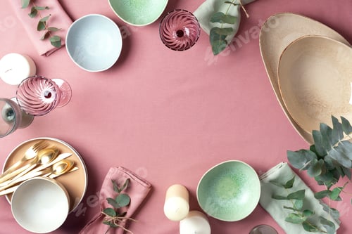 Preview: Table served for festive spring dinner. Top view. Copy space. Empty serving plates, bowls, candles