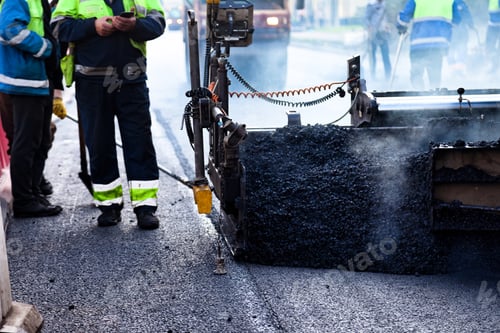 Preview: Urban Road Construction Crew Paving City Street With Hot Asphalt Concrete