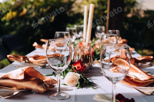 Preview: Beautiful tablescape set up for an elegant dinner at a wedding