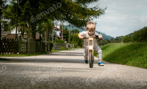 Preview: Boy has great fun riding a balance bike while learning to balance on a bike