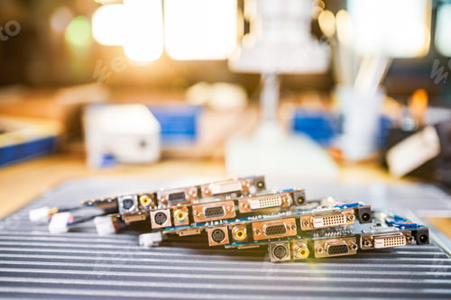 Preview: Close-up electric green embedded microcircuits in production