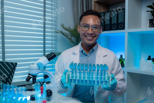 Preview: a chemist or scientific researcher looks at the camera while in a lab, a highly skilled scientist wo