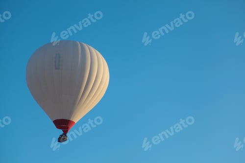 Preview: Hot air balloon flying over the famous tourist place Cappadocia at at winter time
