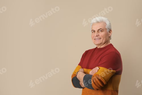 Preview: Portrait of handsome mature man on color background. Space for text
