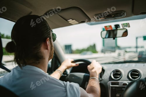 Preview: Man driving a car traveling roadtrip