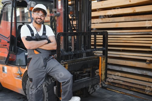 Preview: Arab worker leaning on forklift in lumber warehouse