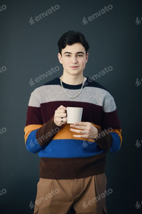 Preview: Young Employee Drinking Coffee During Break