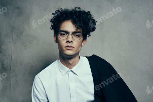 Preview: curly hair young man in shirt classic suit photography studio model on fabric background