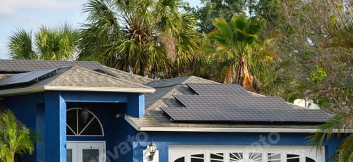 Preview: Residential house with rooftop covered with solar photovoltaic panels