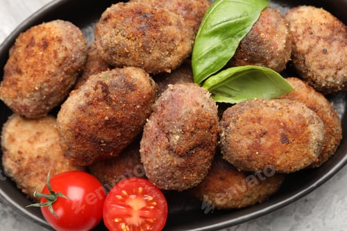 Preview: Tasty meat patties with basil and tomatoes on grey table, top view
