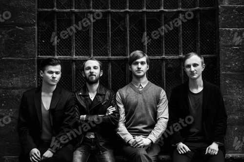 Preview: stylish handsome group of confident and successful men standing on the background of city street