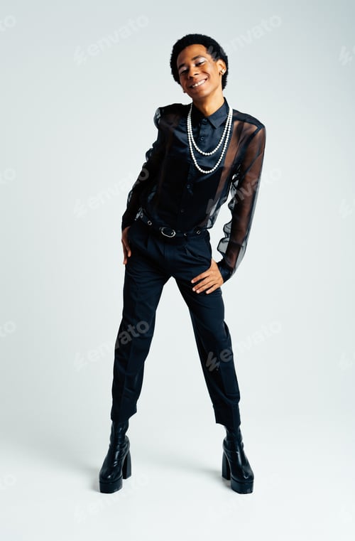 Preview: Fashionable fluid gender man posing in studio