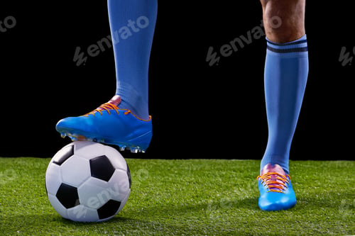 Preview: Go for goal. Full length studio shot of a handsome young soccer player isolated on black.