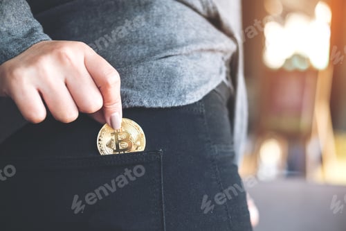 Preview: a woman picking up and dropping bitcoin into a black jean pocket