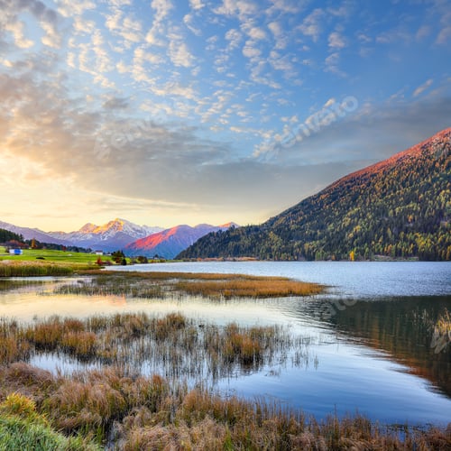 Preview: Gorgeous autumn view of Haidersee (Lago della Muta) lake with Ortler peak on background.
