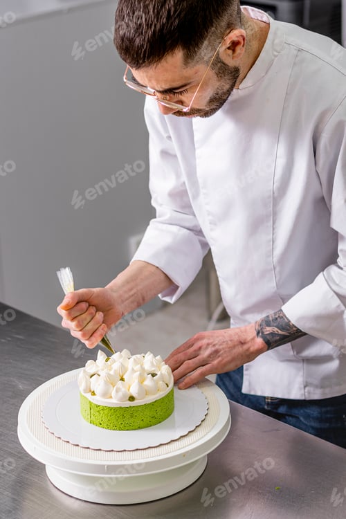 Preview: Colombian Pastry Chef. Young chef decorating a lime and lemon cake