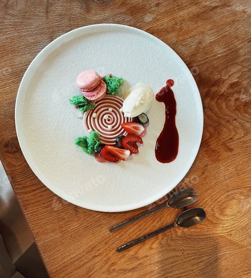 Preview: Elegant strawberry soufflé desert with ice-cream, macaroon, fresh berries and red berry sauce.
