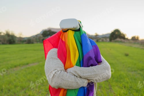 Preview: Man with arms crossed while wearing virtual reality glasses in a field