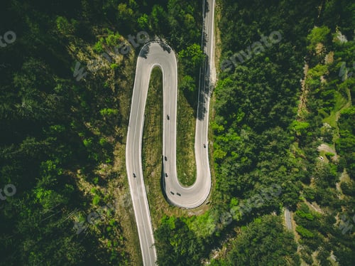 Preview: Aerial view of winding road with cars and motorcycles in Italy