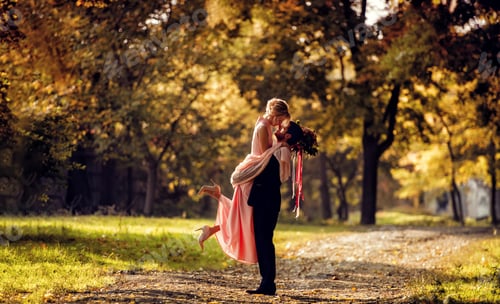 Preview: Bride and groom spinning on road in green park