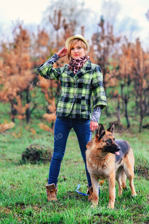 Preview: German Shepherd playing with pretty girl in the forest