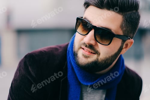 Preview: Handsome young man on a walk in town