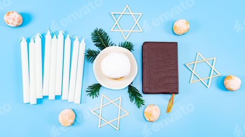 Preview: One large donuts with powder and cream in a saucer on fir branches, nine white candles, a Bible.